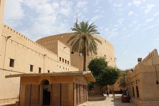 Amouage & Nizwa Full-Day Tour: Fort, Souq & Barakat Al Mouz - Lunch with Omani coffee, dates, and halwa