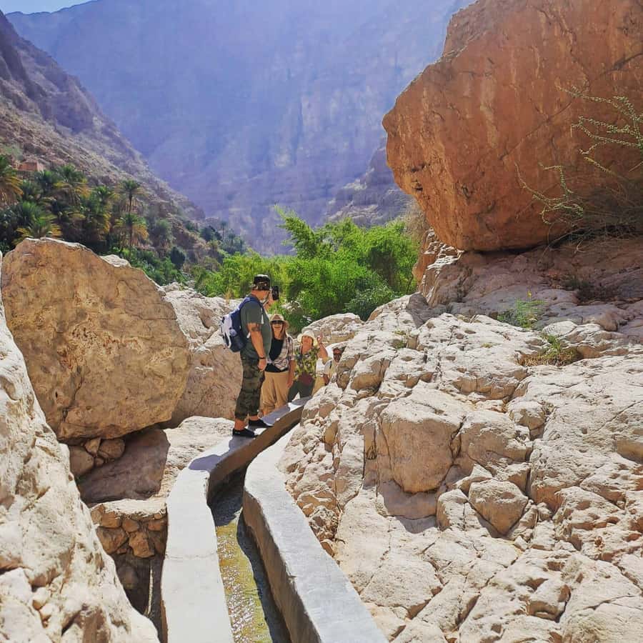 From Muscat: Wadi Shab Expedition - Crossing the Water and Starting the 3.5-Hour Wadi Walk