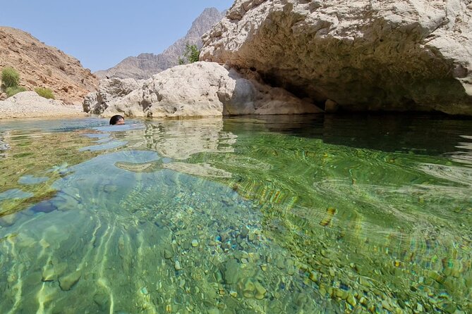 Full-Day Bimmah Sinkhole and Wadi Al Arbeieen Tour - Fins Beach brings open sand and sea views
