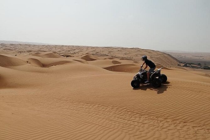 Full-Day Private Experience through Desert Adventure in Oman - Quad biking across the orange dunes