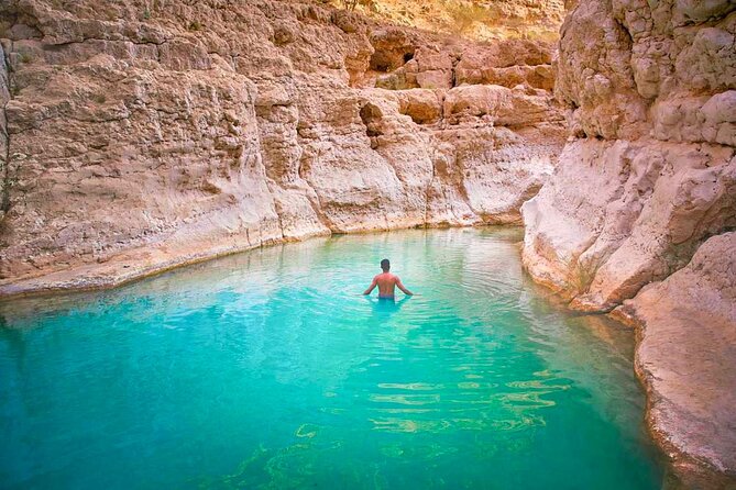 Full Day Wadi Shab And Bimah Sinkhole with Pick Up Included - Swimming toward the cave waterfall