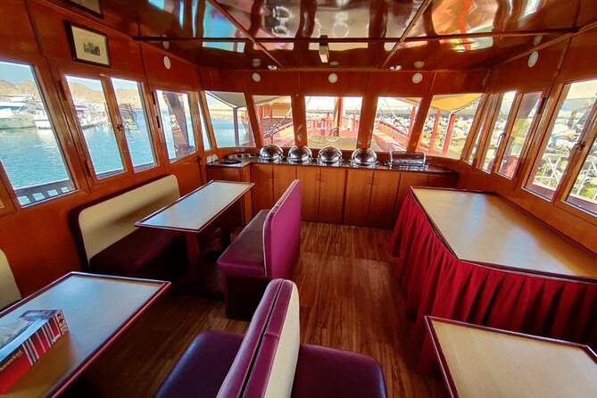 Omani Traditional Dhow Cruise: Sunset and Muscat Coastal View - Omani coffee, dates, and simple refreshments