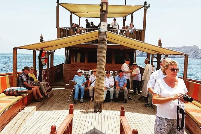 Omani Traditional Dhow Cruise: Sunset and Muscat Coastal View - The dhow itself sets the tone