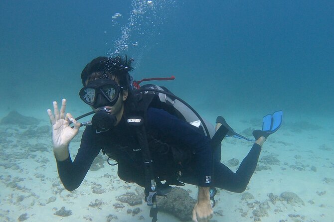 Scuba Diving in muscat - Getting fitted with wetsuit, mask, fins, and tank