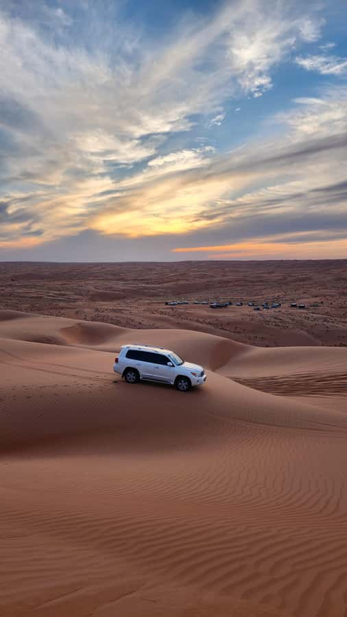Sunset at wahiba desert - The road from oasis to Wahiba Sands